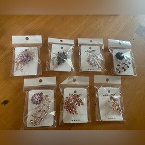 Lot of seven jeweled floral butterfly brooches